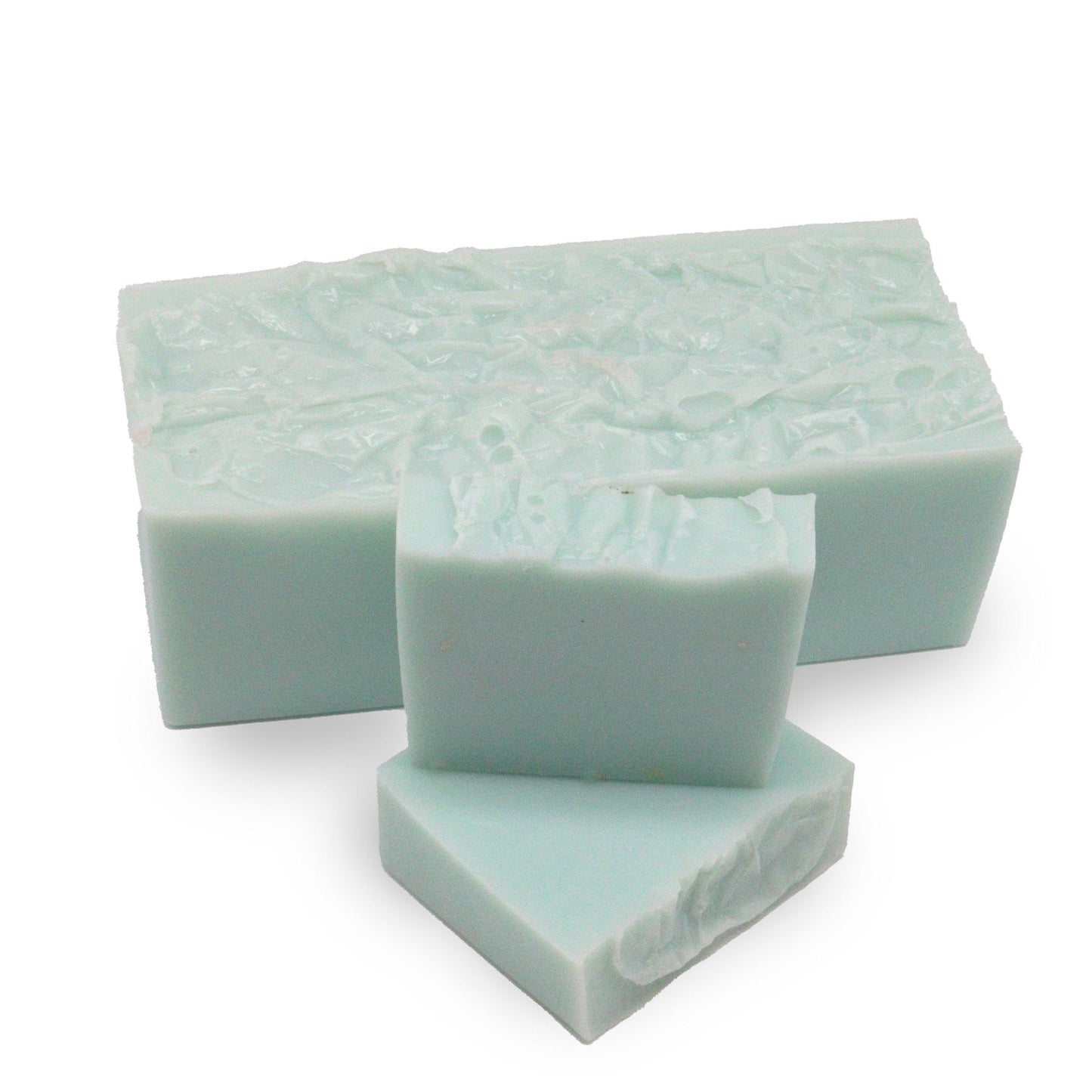 Handcrafted purple and blue marbled soap loaf with a textured top and natural dried botanical inclusions.