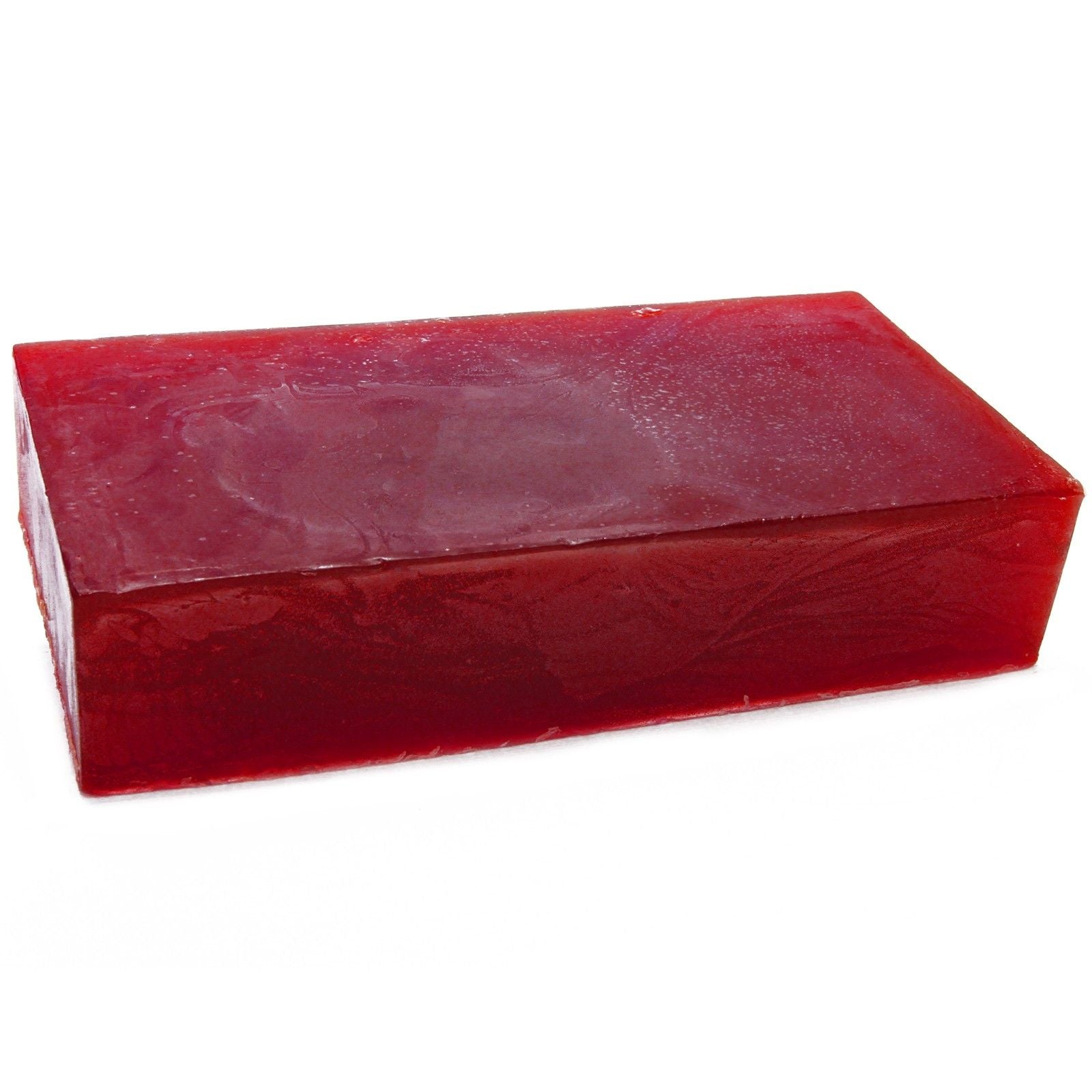 Large artisanal soap loaf infused with ylang ylang and orange essential oils, showing a natural textured surface.