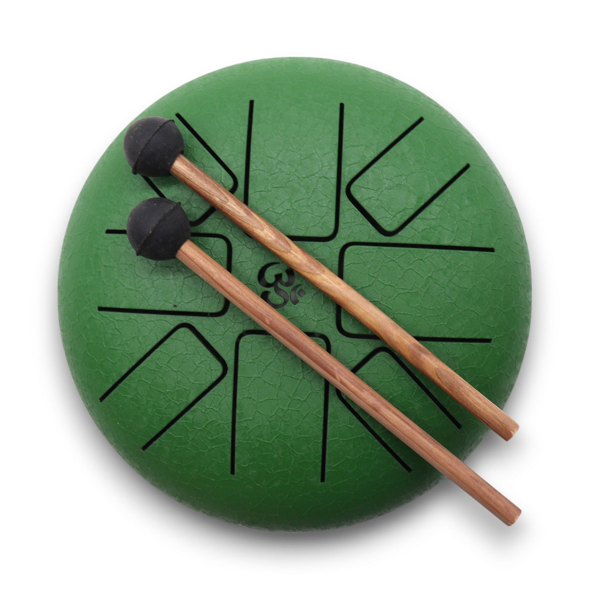 Small circular green steel tongue drum with an engraved Om symbol and matching mallets on a neutral background.