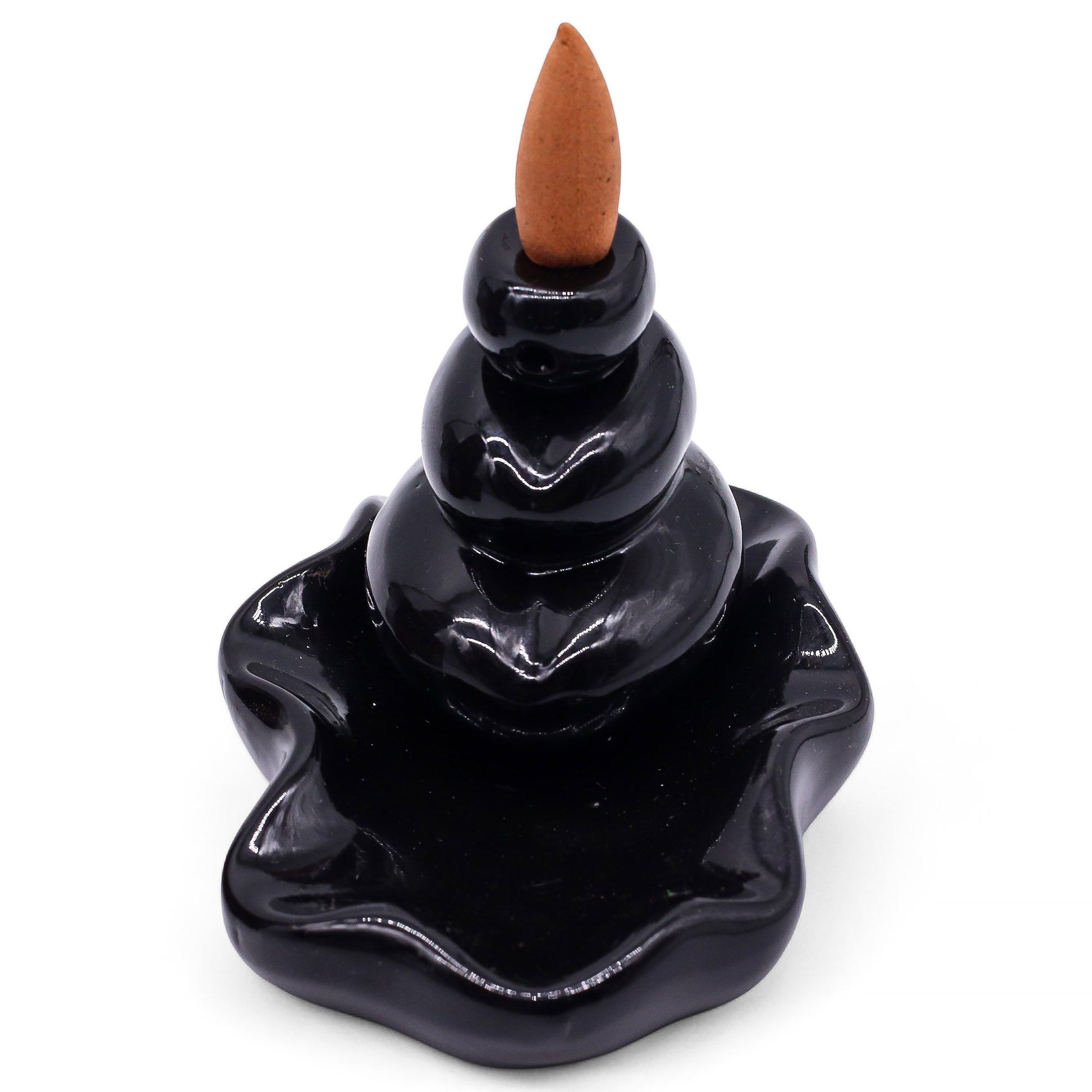 A pack of ten hexagon-shaped masala backflow incense cones with a rich, dark Oudh fragrance for spiritual rituals.