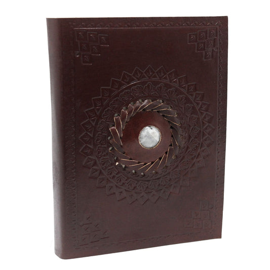 Handcrafted brown leather notebook featuring an embossed moonstone design, vintage metal clasps, and rustic burnt edges.