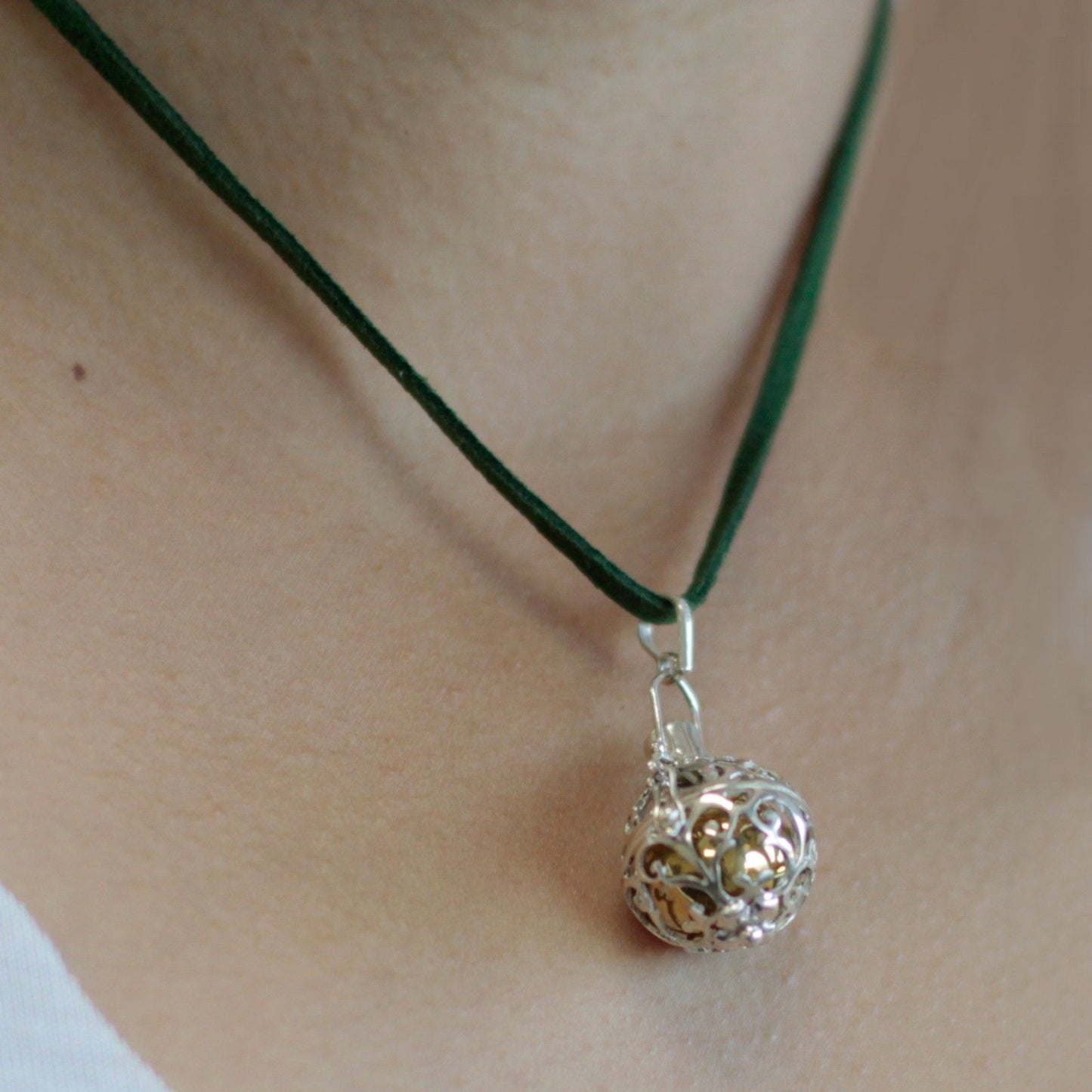 Detailed 18mm 925 sterling silver angel bell pendant with intricate romance-themed engravings and a small loop for hanging.