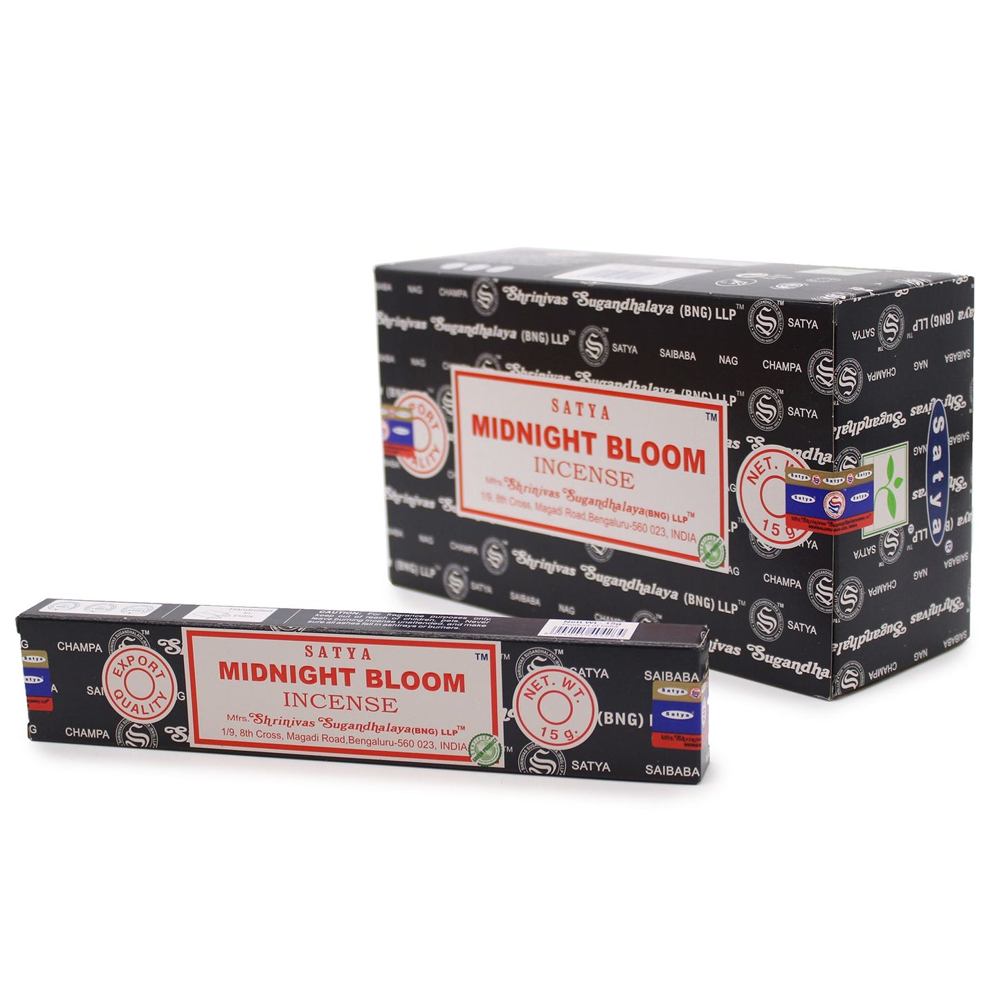 Hand-rolled incense sticks in a blue box with floral designs, releasing a thin stream of aromatic smoke.