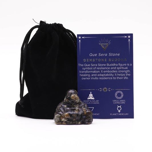 A small, hand-carved Buddha figurine made from speckled blue and grey Que Sera gemstone.