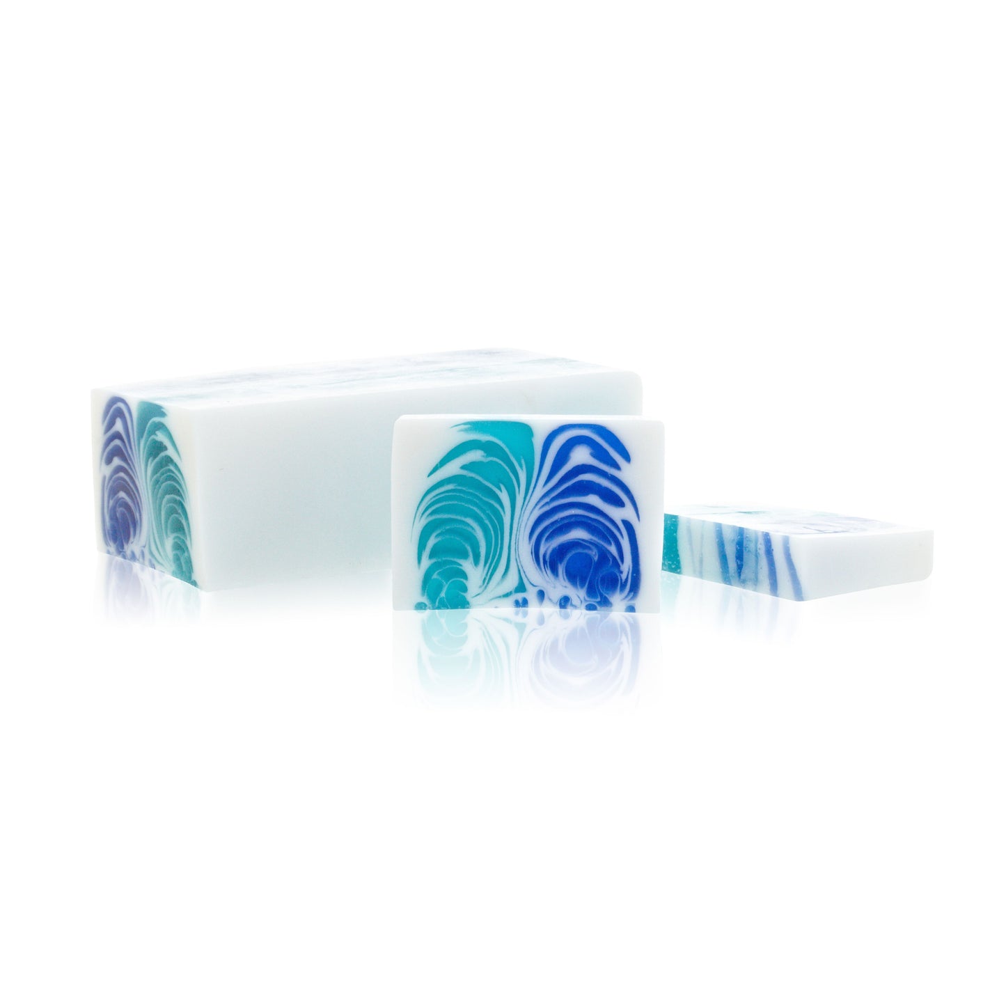 Artisan handcrafted soap loaf with a marine fresh blue and white swirl design and textured surface.
