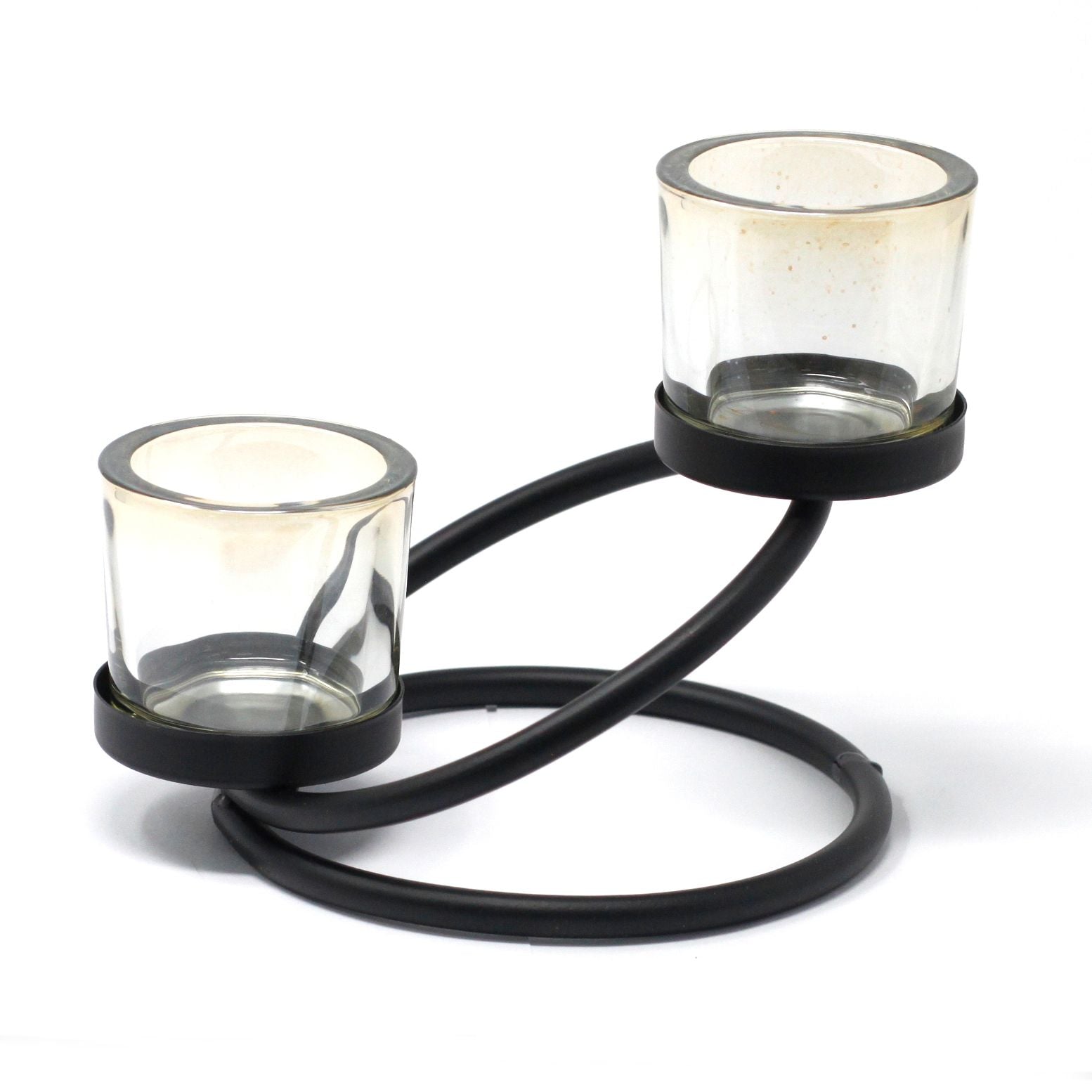 Minimalist black iron candle holder with a double-step design and two clear glass votive cups on a flat surface.