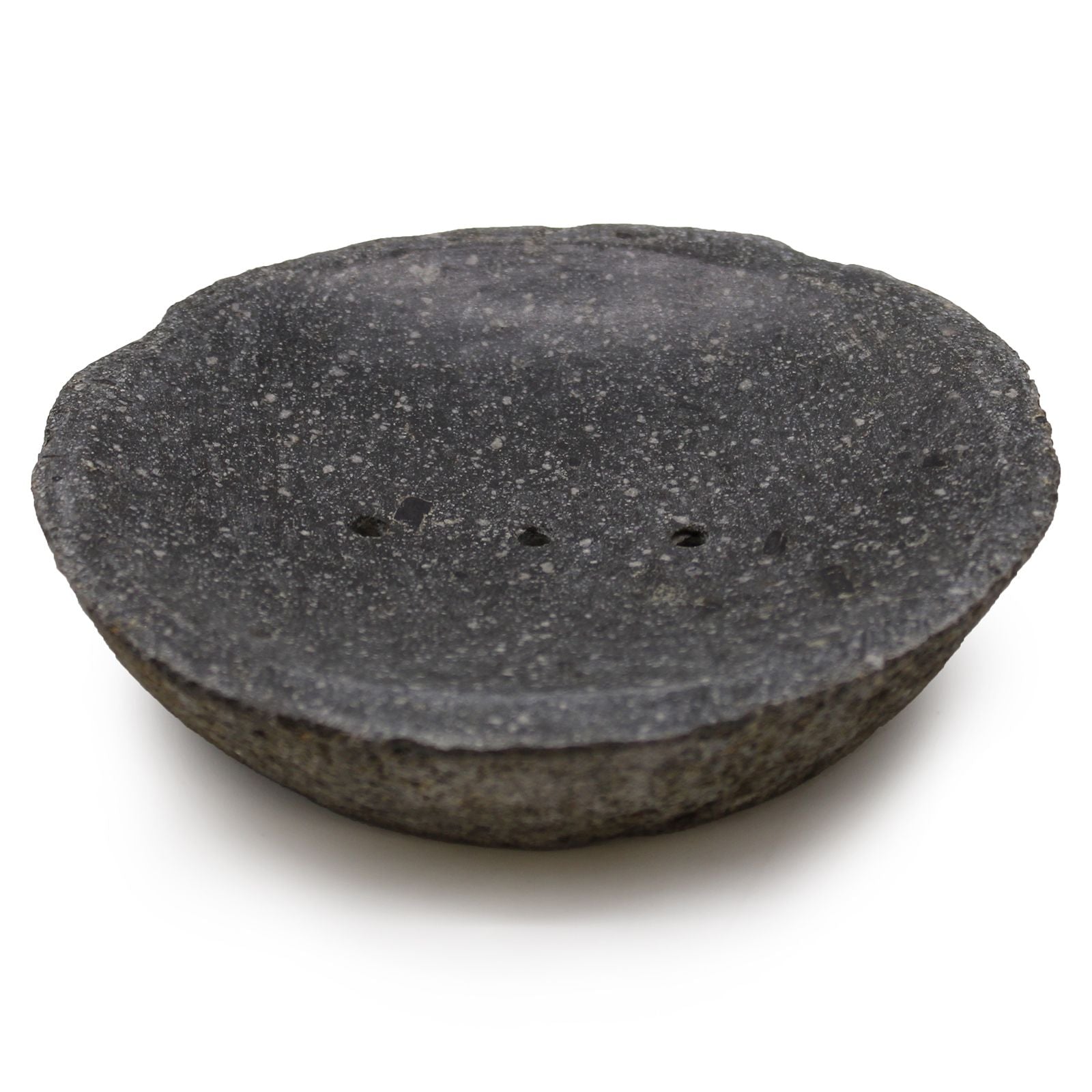 Handcrafted grey river stone soap dish with a polished surface, drainage holes, and raw organic edges.