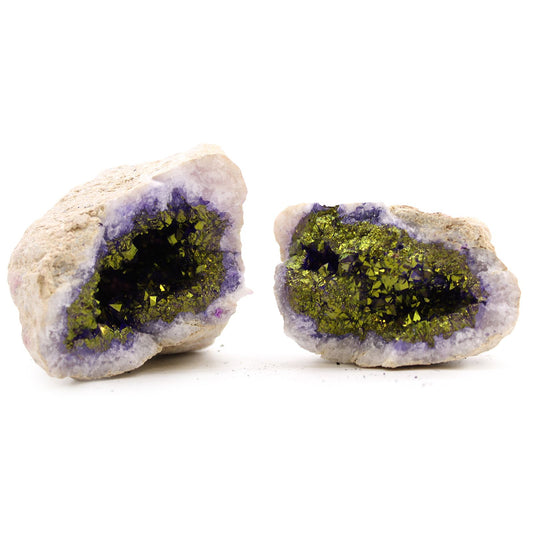 A natural rock geode split open to reveal vibrant purple and gold coloured calcite crystals inside its hollow centre.