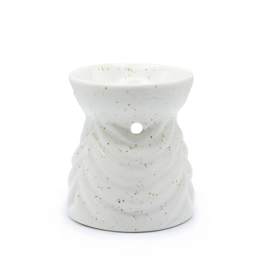 Elegant ivory ceramic oil burner with a modern geometric cut-out design and a smooth matte finish.