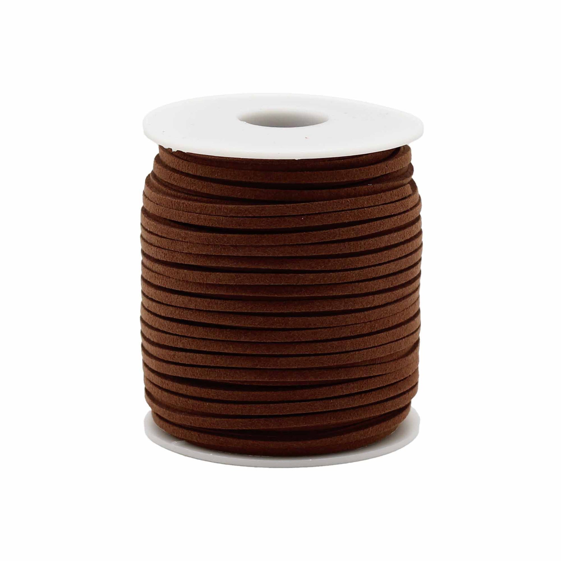 Close-up of a bulk roll of dark brown faux suede pendant cord for jewellery making and crafting.