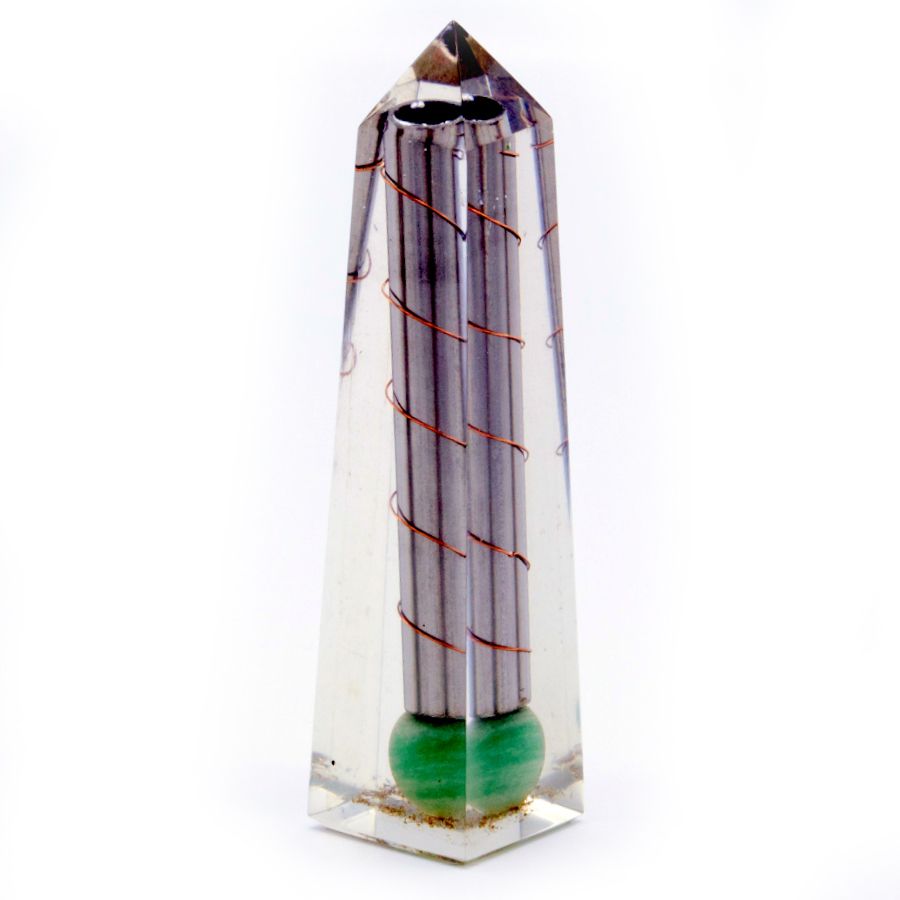 Tall green aventurine orgonite obelisk tower with internal metal shavings and copper coil on a plain background.