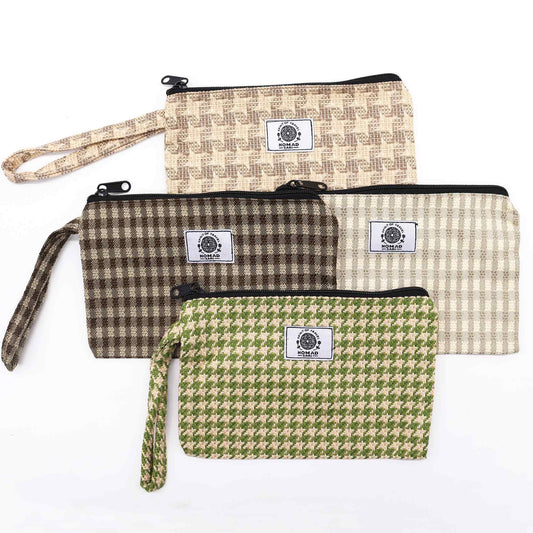 Textured fabric gift pouch with a loop fastener made from natural materials in an assorted variety.