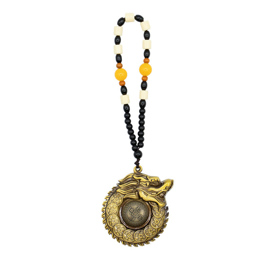 Intricate gold-coloured Feng Shui hanging featuring a dragon encircling a central wealth coin for protection.