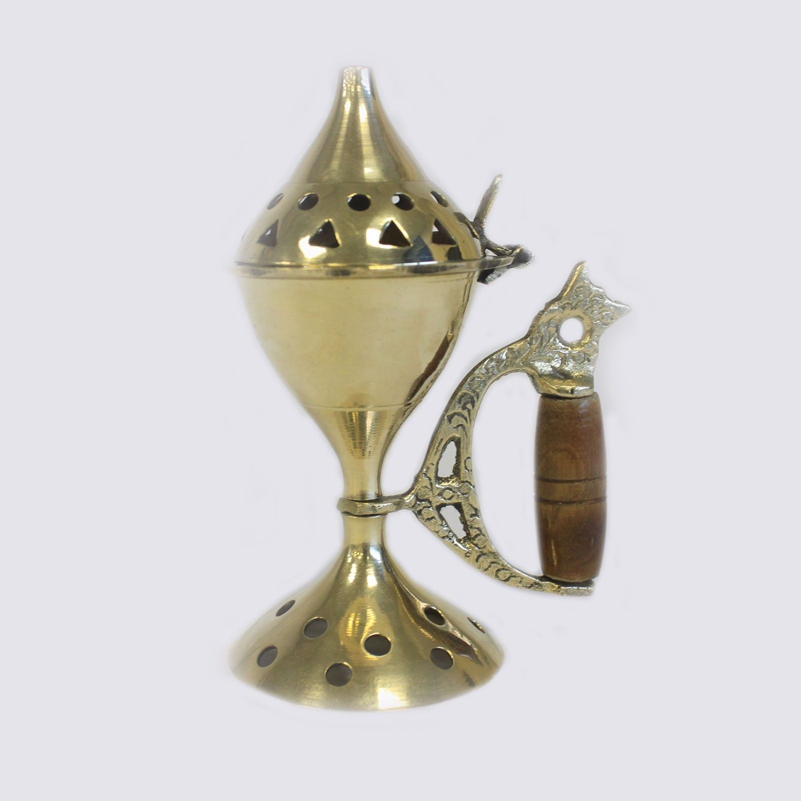 Polished brass incense cone burner with a decorative carved handle and a vented lid for smoke release.