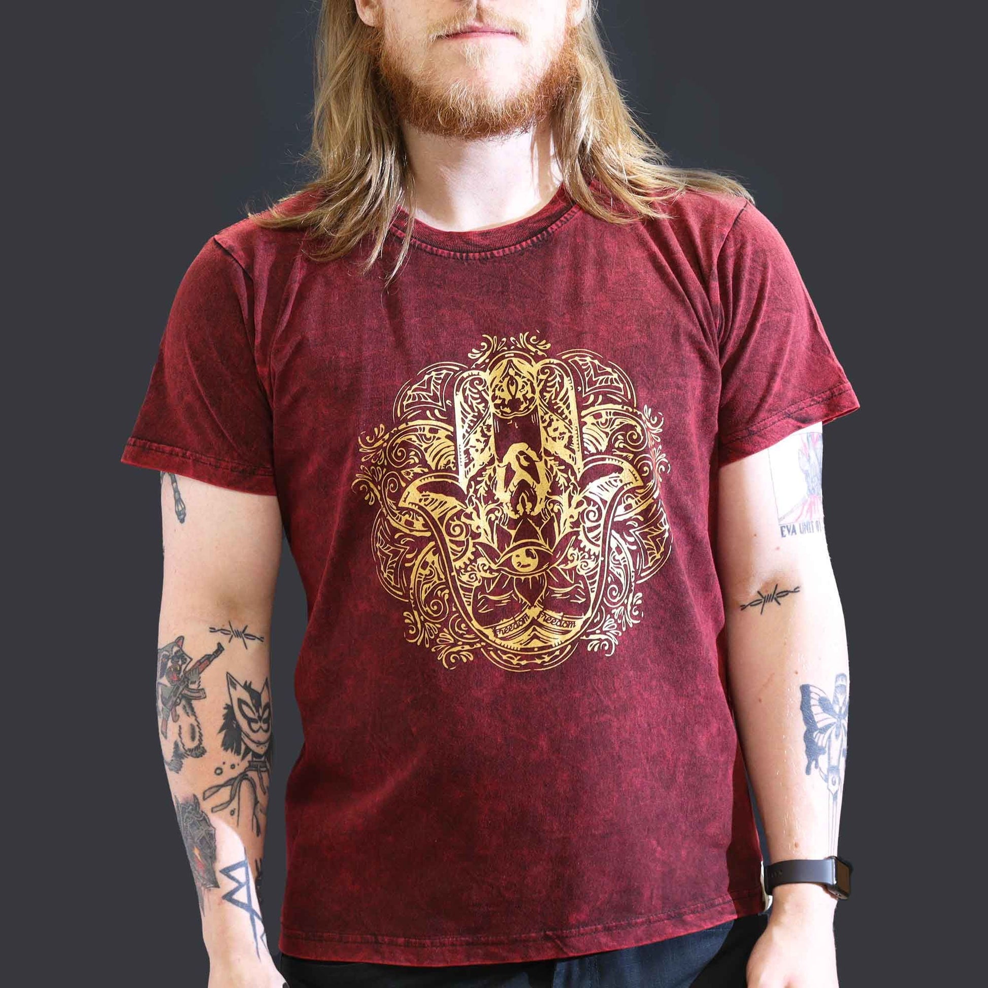 Large maroon stone-washed t-shirt featuring a decorative Hamsa hand symbol on the front.