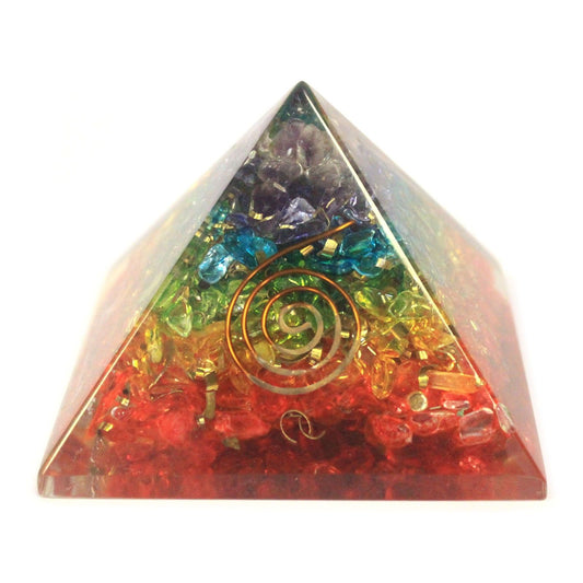 Large 70mm orgonite pyramid filled with colourful chakra gemstone chips and copper shavings in clear resin.