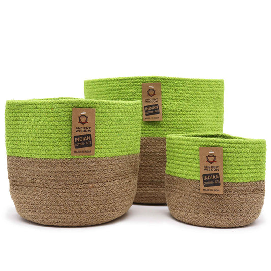 Three nested round storage baskets made of woven cotton rope in a soft pistachio green colour.
