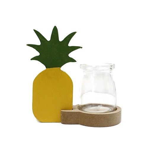 Unique glass hydroponic vase in a pineapple shape for displaying plant stems and flowers on a tabletop.