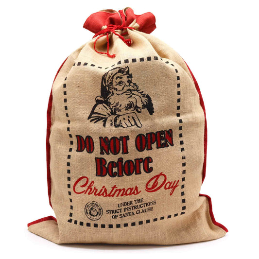 Large rustic jute Christmas sack with Do Not Open Before Christmas Day text and festive stamp design.