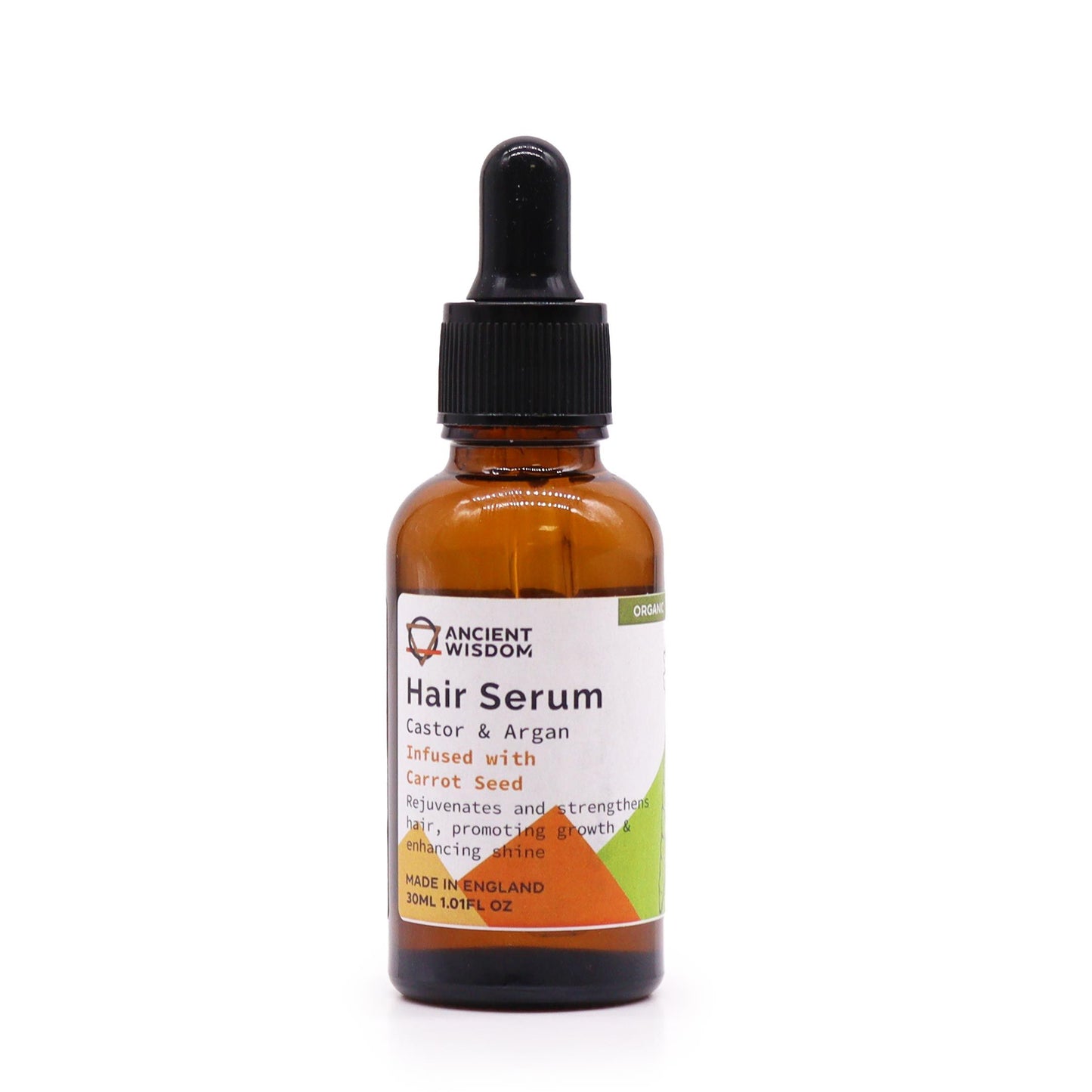 A small amber glass bottle of organic hair serum with a pipette dropper on a neutral background.