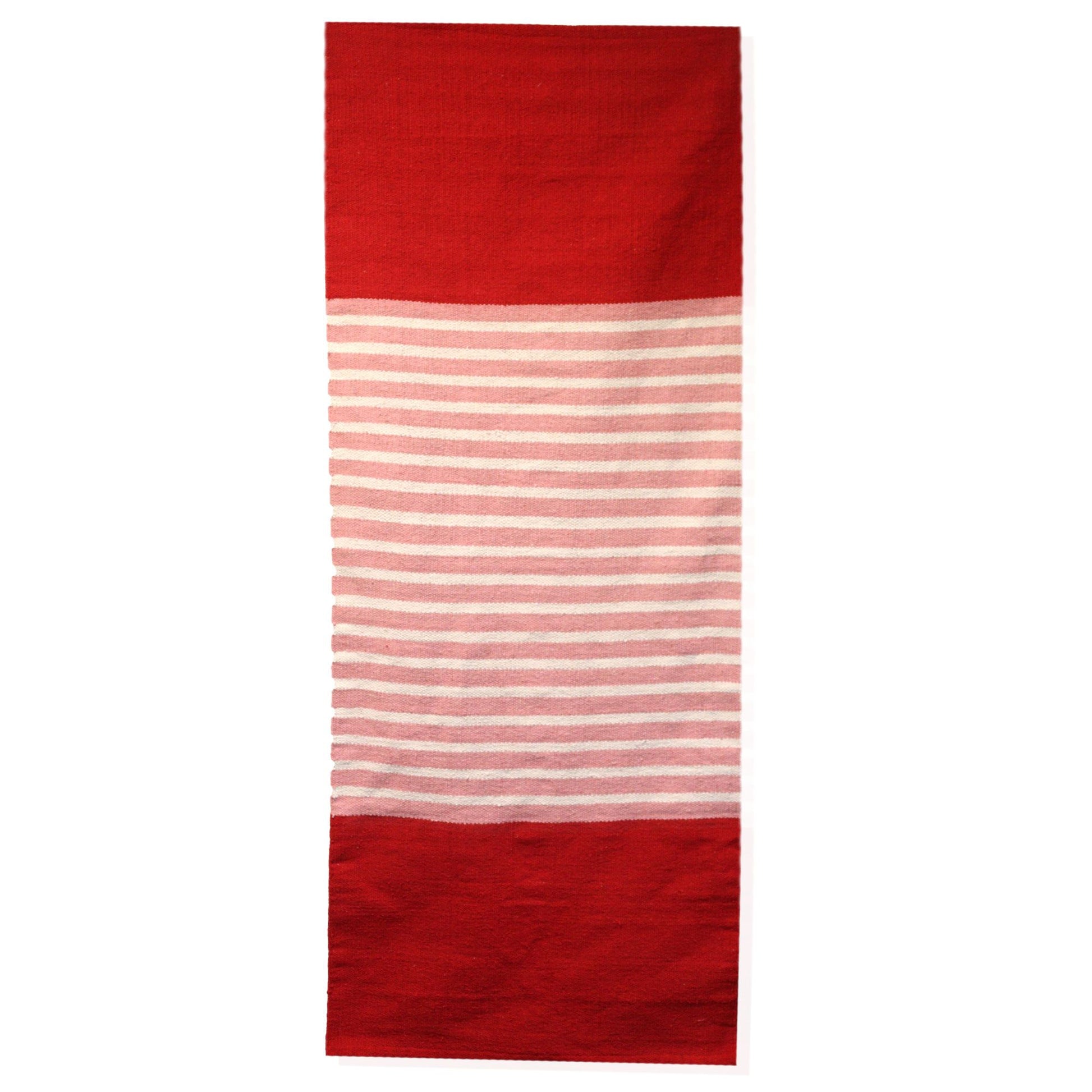 Handcrafted Indian cotton rug in vibrant red and pink tones, ideal for yoga or home decor.