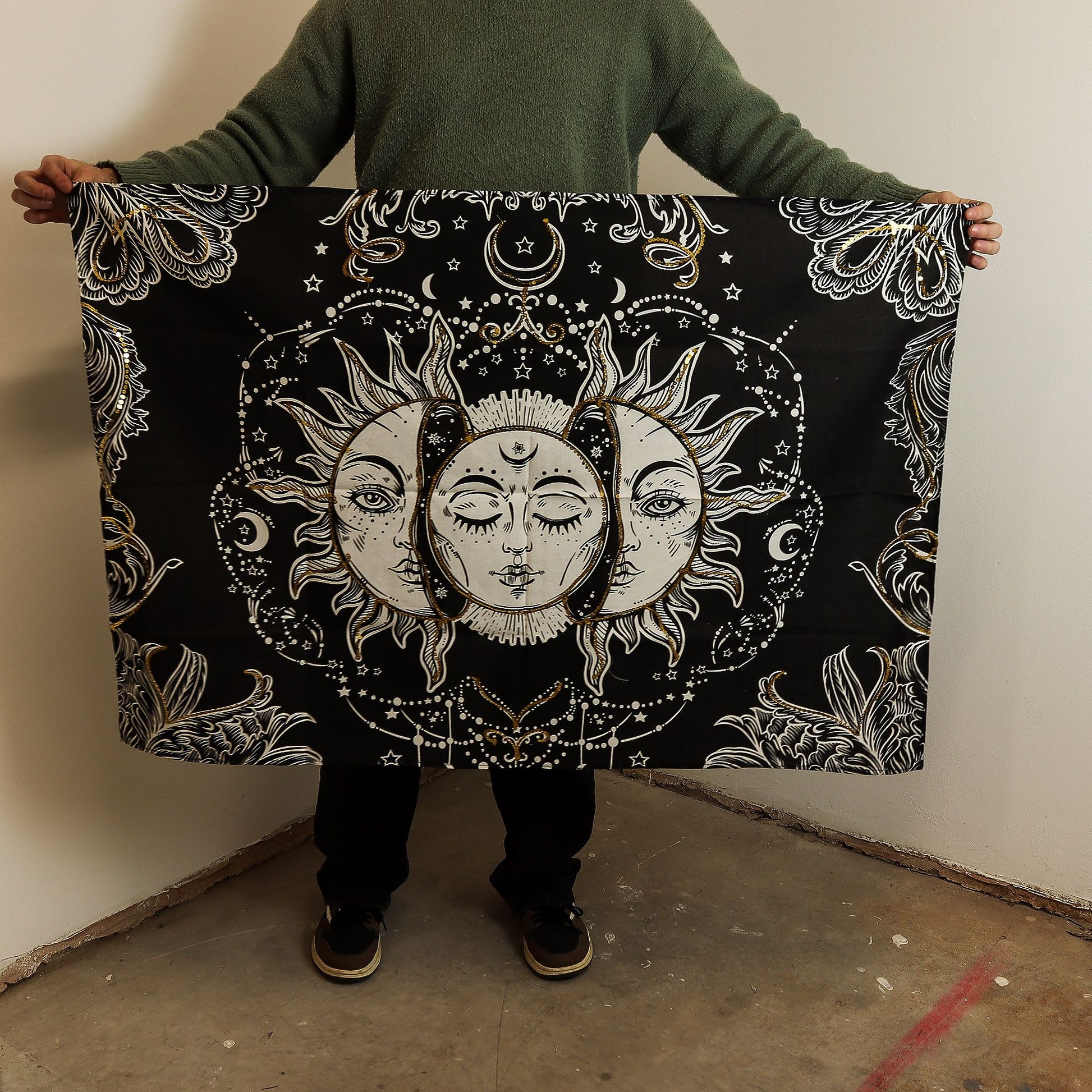 Mystical black cotton wall hanging featuring an elegant gold and white sun goddess with celestial details.