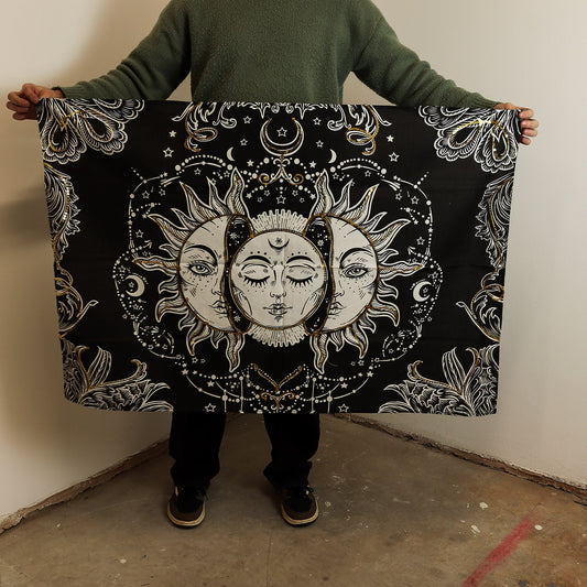 Mystical black cotton wall hanging featuring an elegant gold and white sun goddess with celestial details.