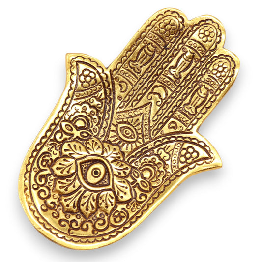 Small gold polished aluminium incense holder in the shape of a Hamsa hand with intricate decorative patterns.
