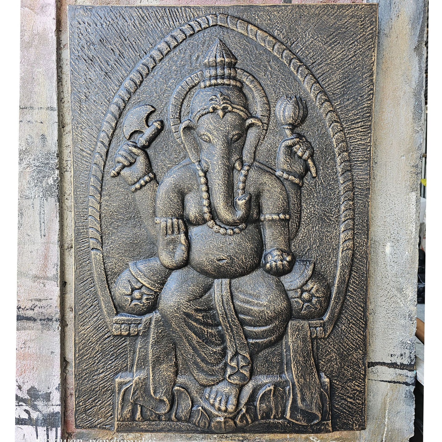 Large iron frame wall hanging featuring a detailed Ganpati deity in an antique gold relief finish.