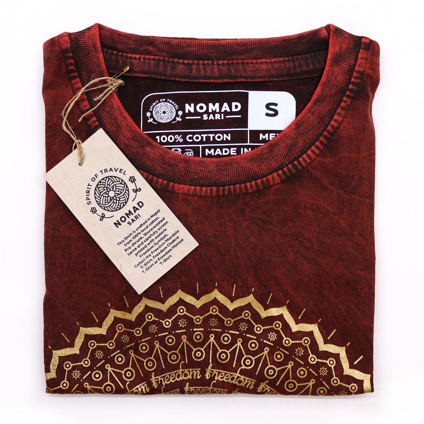 Small maroon stonewashed cotton t-shirt featuring a central white mandala screen print design.