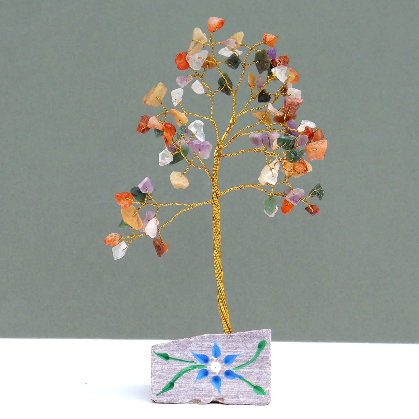 Handcrafted gemstone tree featuring eighty multicoloured crystal stones on flexible wire branches and a natural rock base.