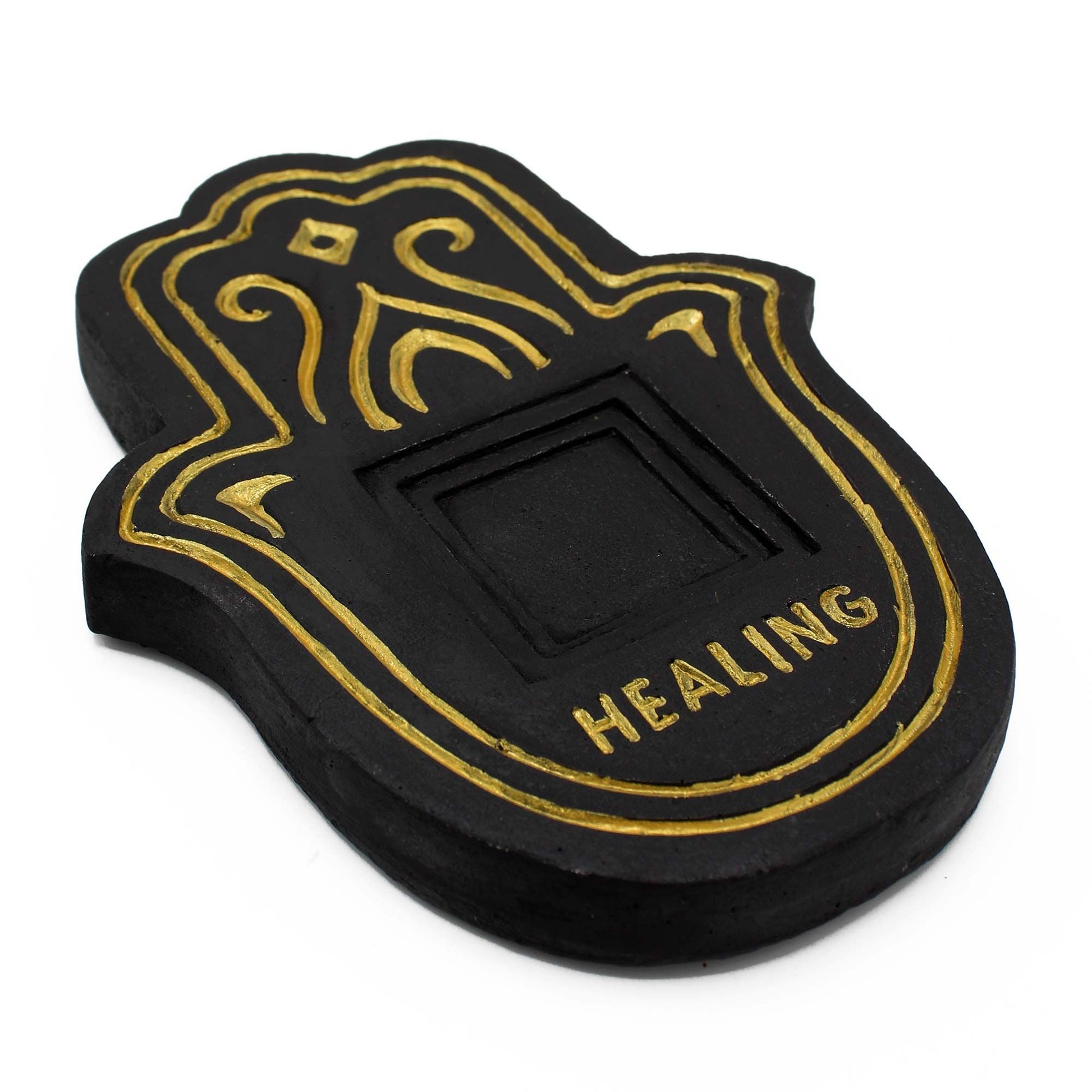 Round black incense plate with a textured gold lava-stone effect and a central hole for incense sticks.