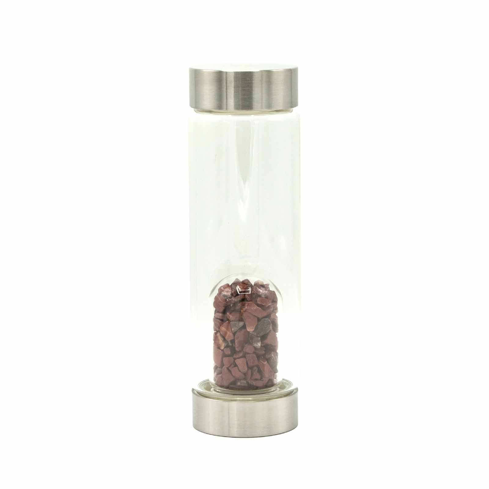 Sleek glass water bottle featuring invigorating red jasper crystal chips at the base for stylish spiritual hydration.