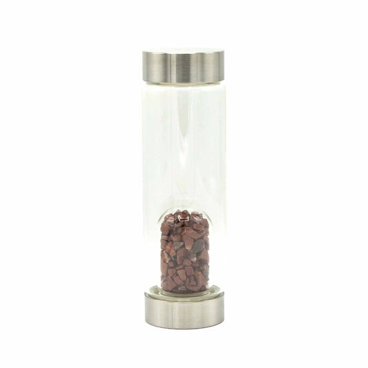 Sleek glass water bottle featuring invigorating red jasper crystal chips at the base for stylish spiritual hydration.