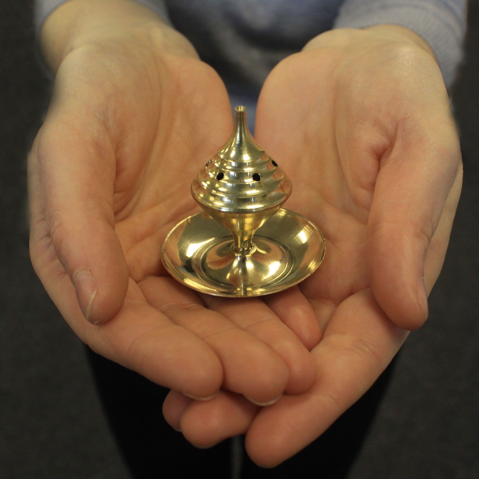 Small polished brass incense burner with a traditional domed lid for even smoke distribution.