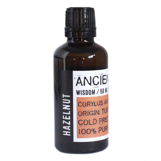 50ml amber glass bottle of light yellow hazelnut base oil with a black dropper cap.