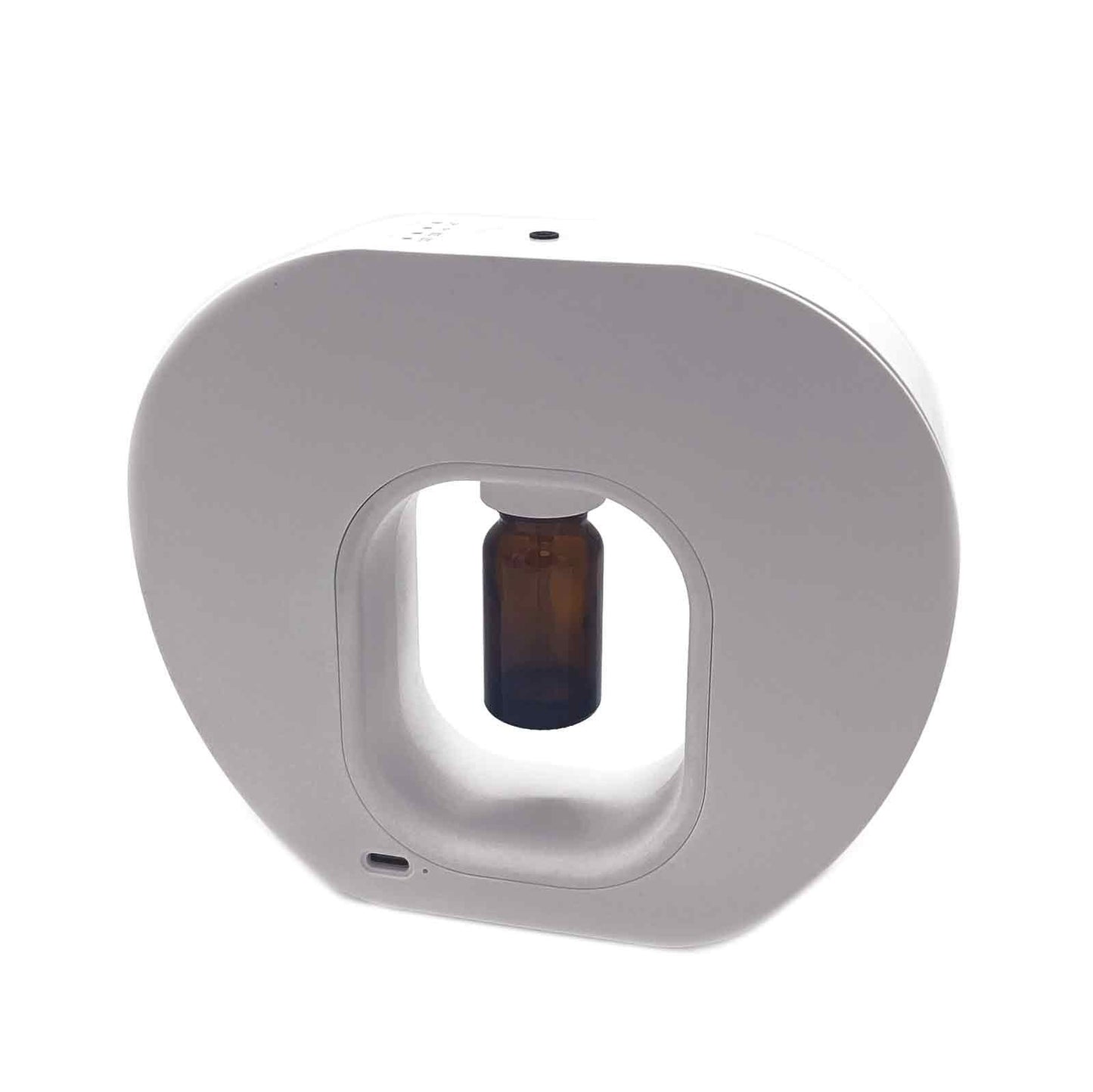 Sleek portable waterless aromatherapy nebulizer with a metallic finish and USB-C charging port.