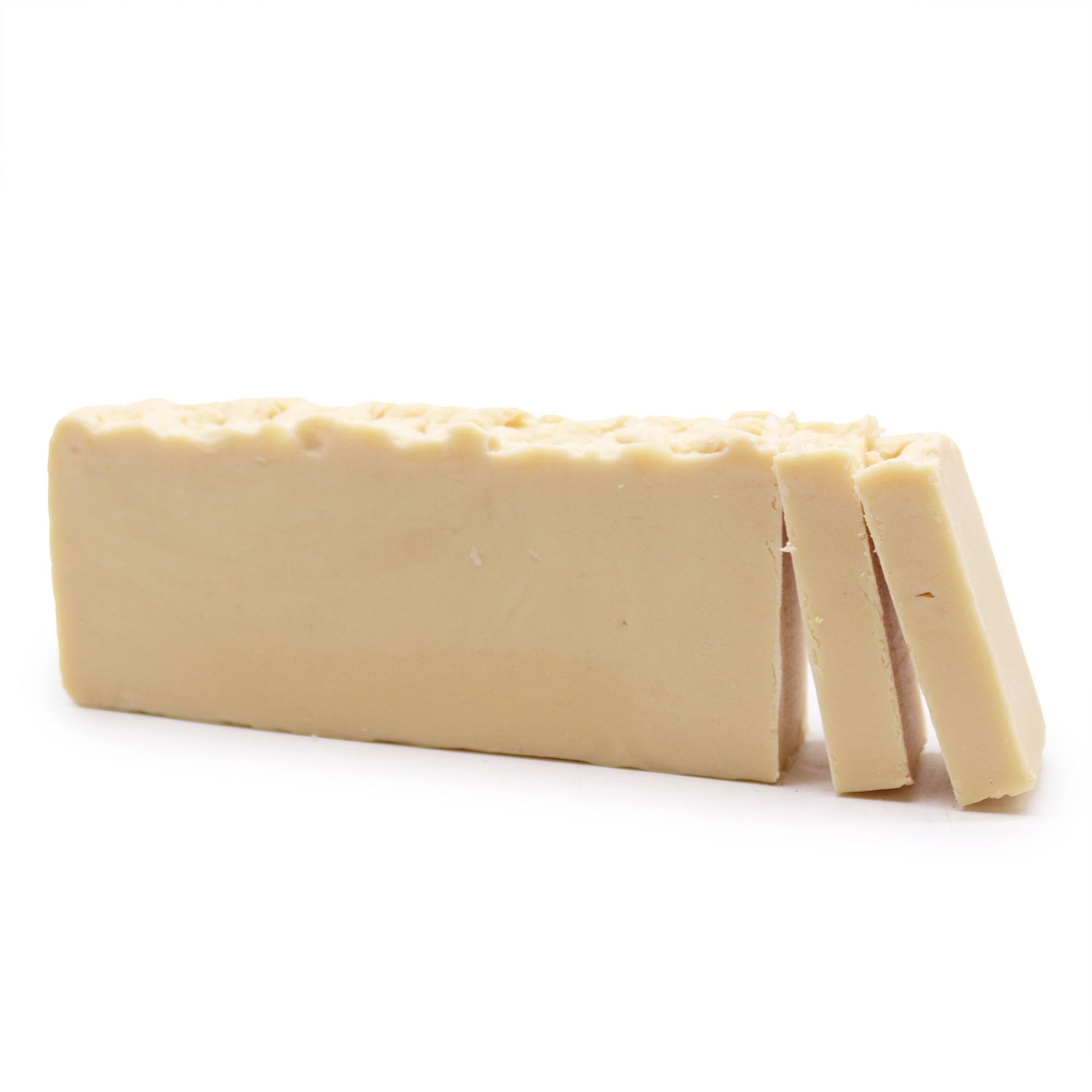 Large rectangular artisan soap loaf made with donkey milk and olive oil, showing a creamy natural texture.