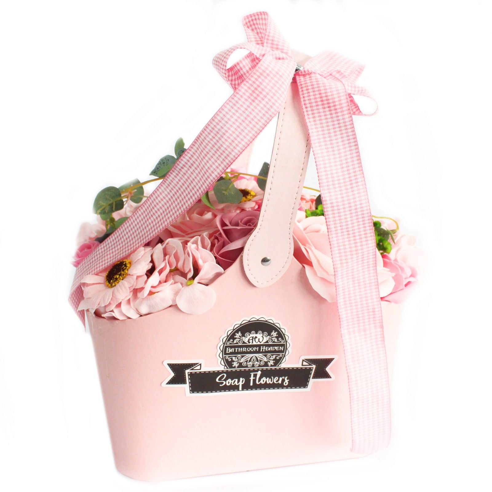 Beautifully arranged pink soap flower roses presented in a charming woven gift basket.
