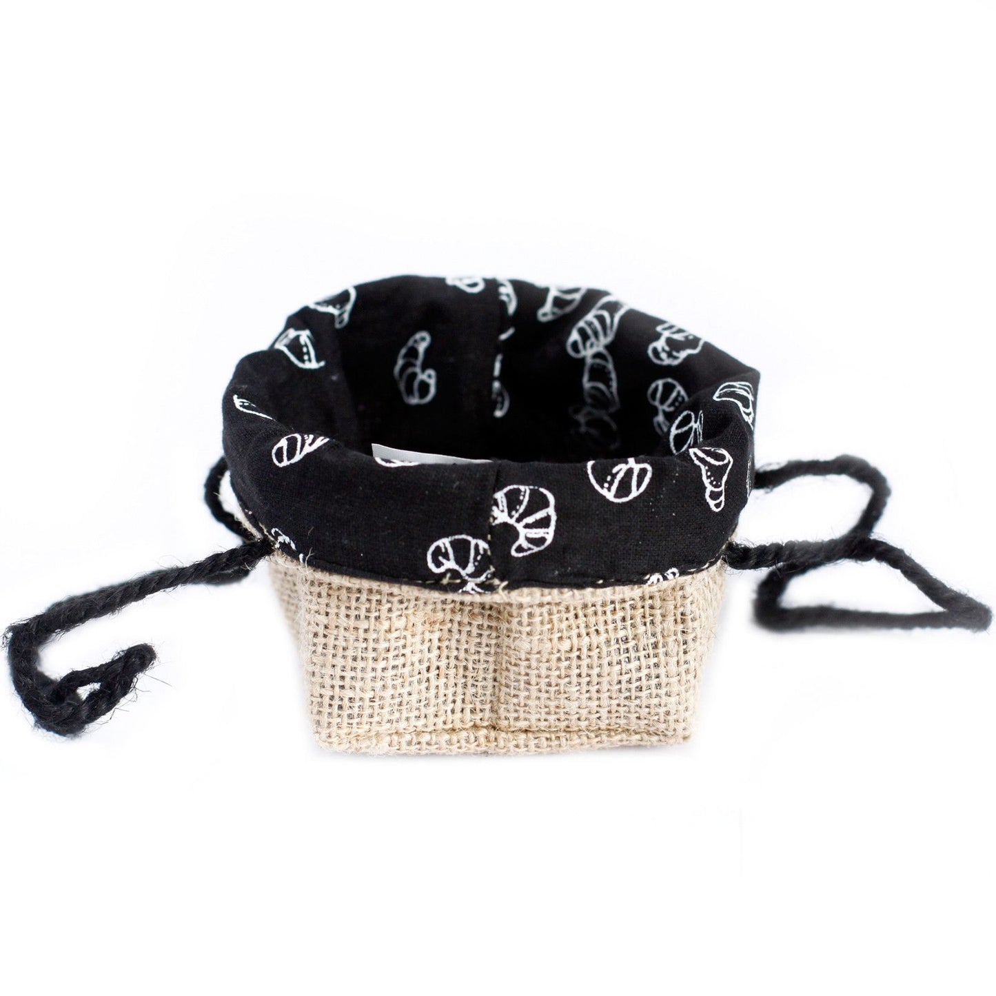 Small natural jute gift bag with a black cotton lining and sturdy woven handles on a plain background.