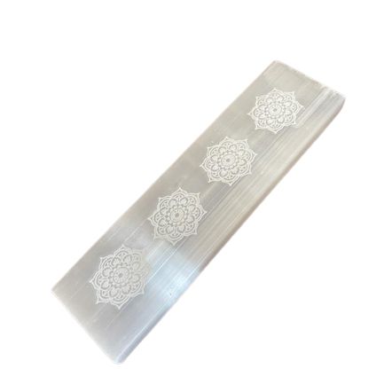 White rectangular selenite charging plate featuring an intricately engraved mandala design.