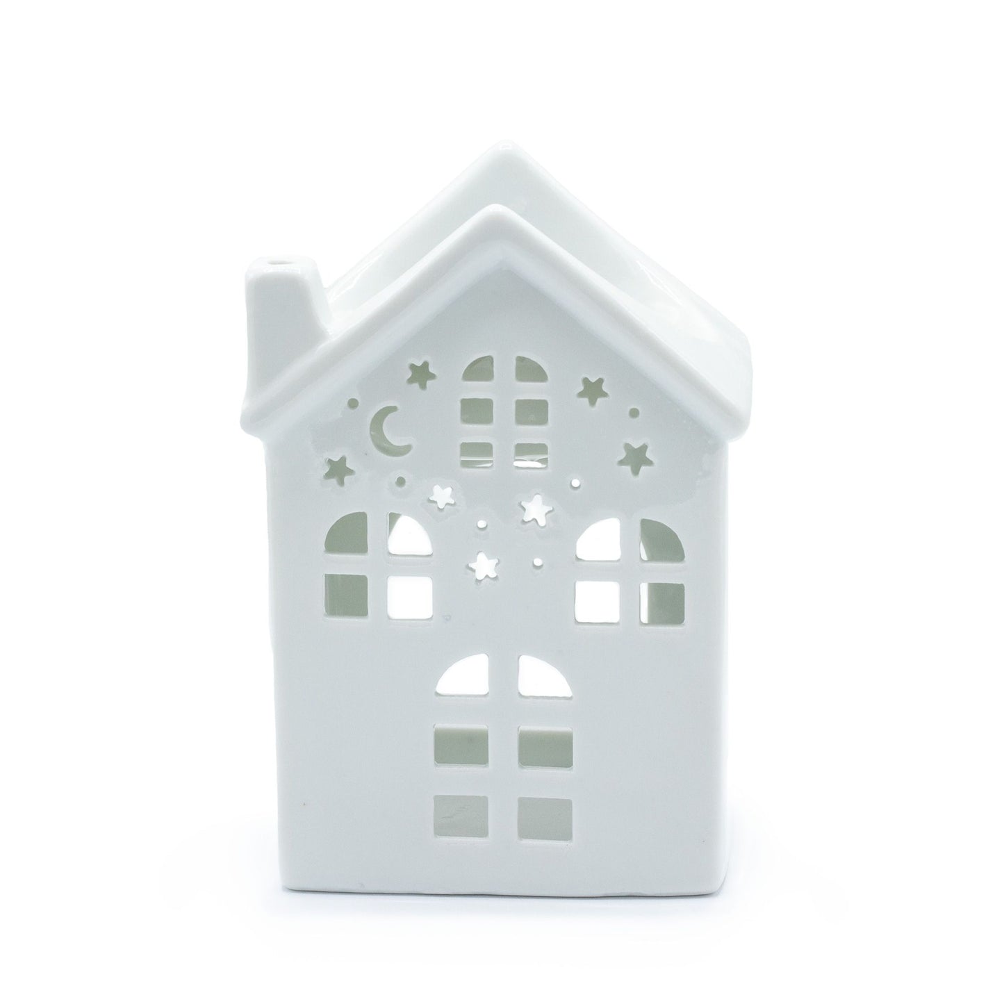 White ceramic oil burner with a decorative house-shaped cutout design and a tea light candle holder base.