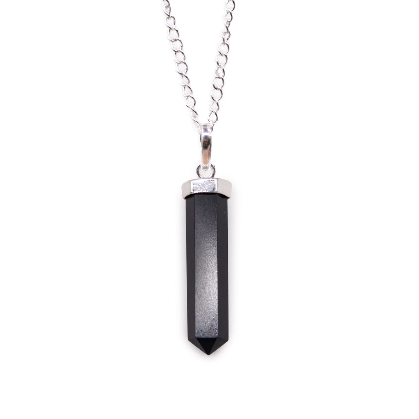 Polished black agate gemstone carved into a classic hexagonal point pendant with a silver-toned bale.