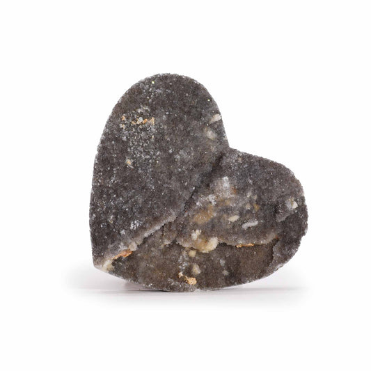 A large, smooth heart-shaped crystal carving made from natural calcite showing unique internal patterns.