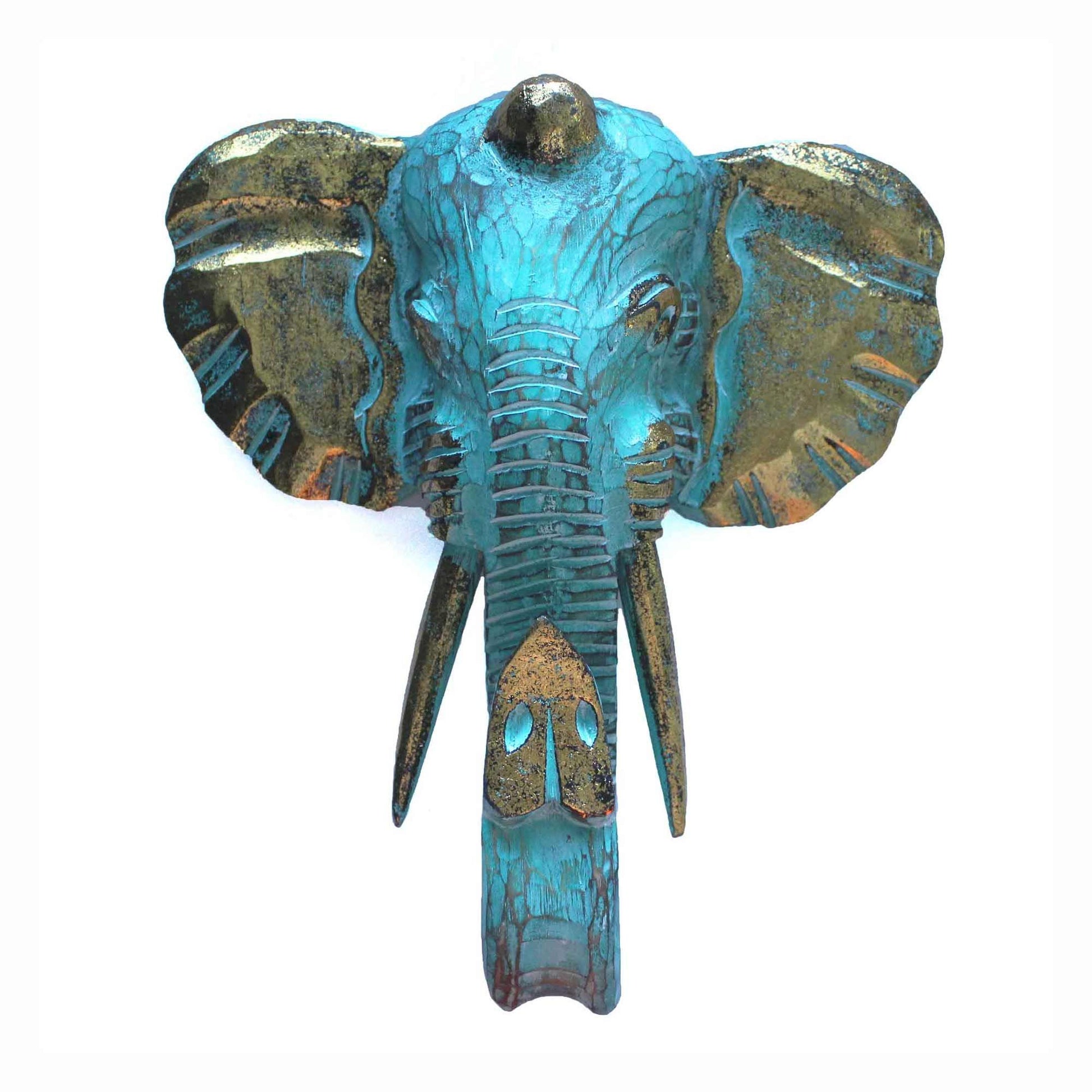 Intricately carved wooden elephant head with a vibrant turquoise and gold finish, showcasing artisan craftsmanship.