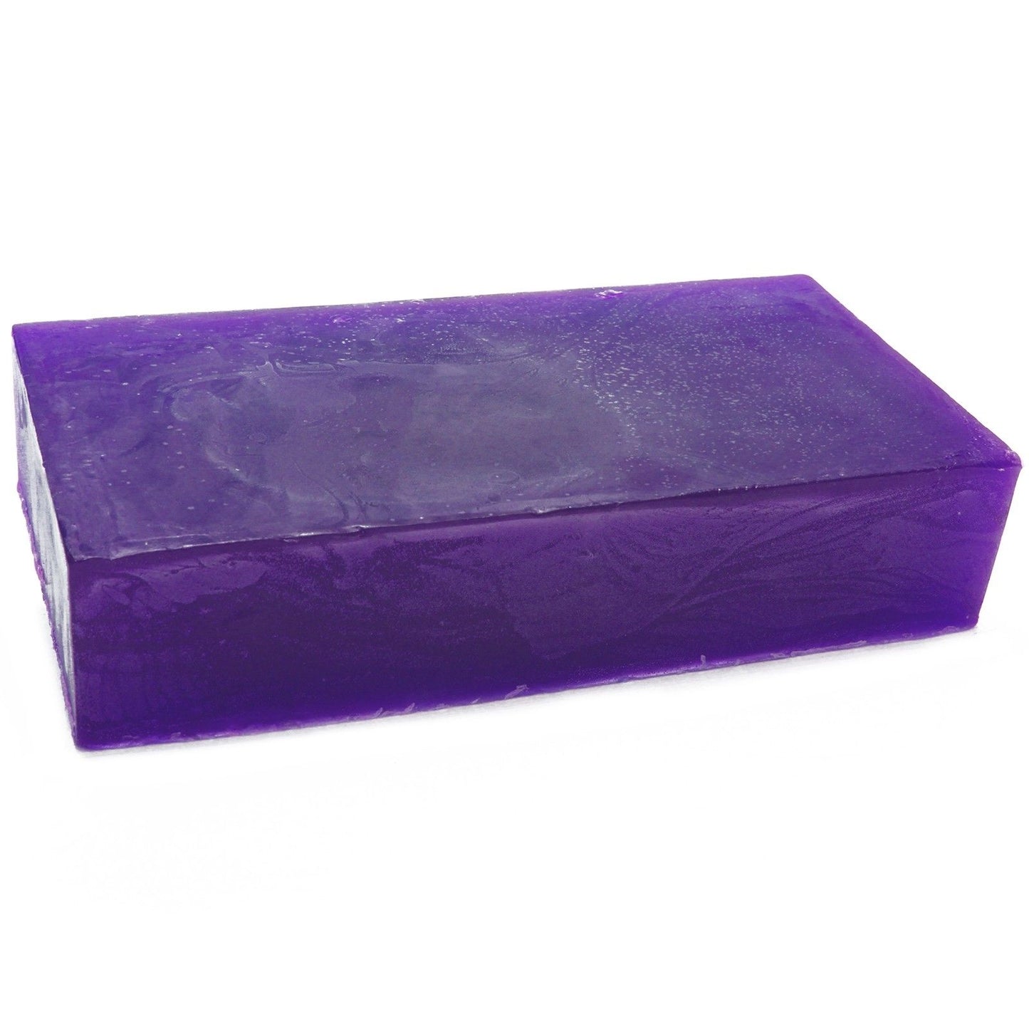Large artisanal pink soap loaf infused with geranium essential oil, showing a rustic textured surface.