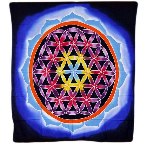 Large colourful batik wall hanging featuring an intricate Flower of Life and Love geometric pattern on fabric.