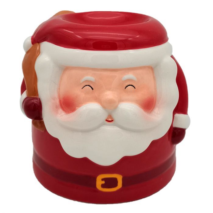 Festive red and white ceramic oil burner shaped like Santa Claus with a hat and beard.
