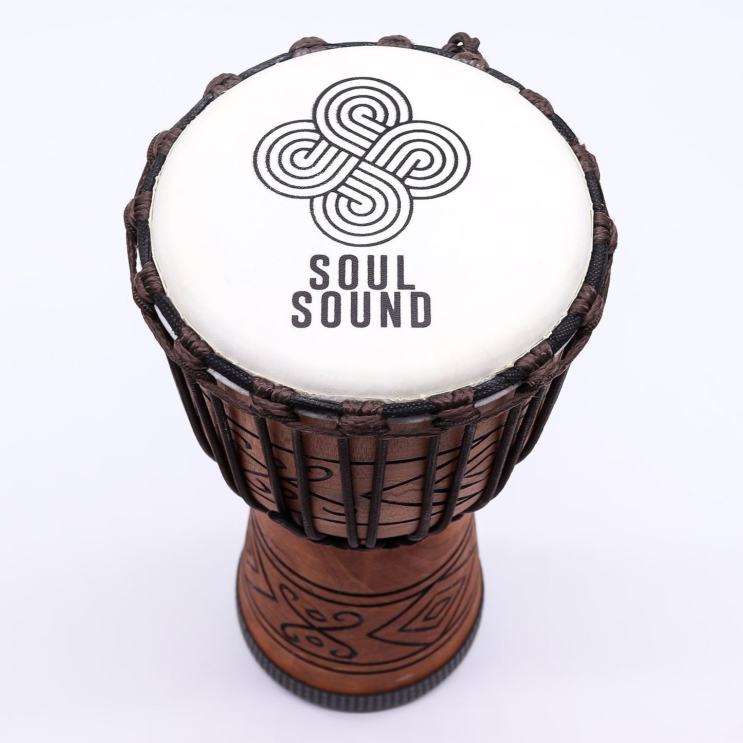 Handcrafted medium-sized professional djembe drum with a natural goat skin head and intricate rope tuning system.