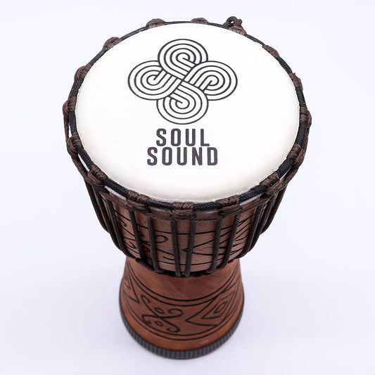 Handcrafted medium-sized professional djembe drum with a natural goat skin head and intricate rope tuning system.